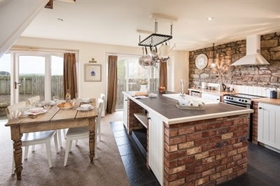 A kitchen with a table and chairs

AI-generated content may be incorrect.