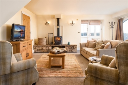 A living room with a television and a fireplace

AI-generated content may be incorrect.