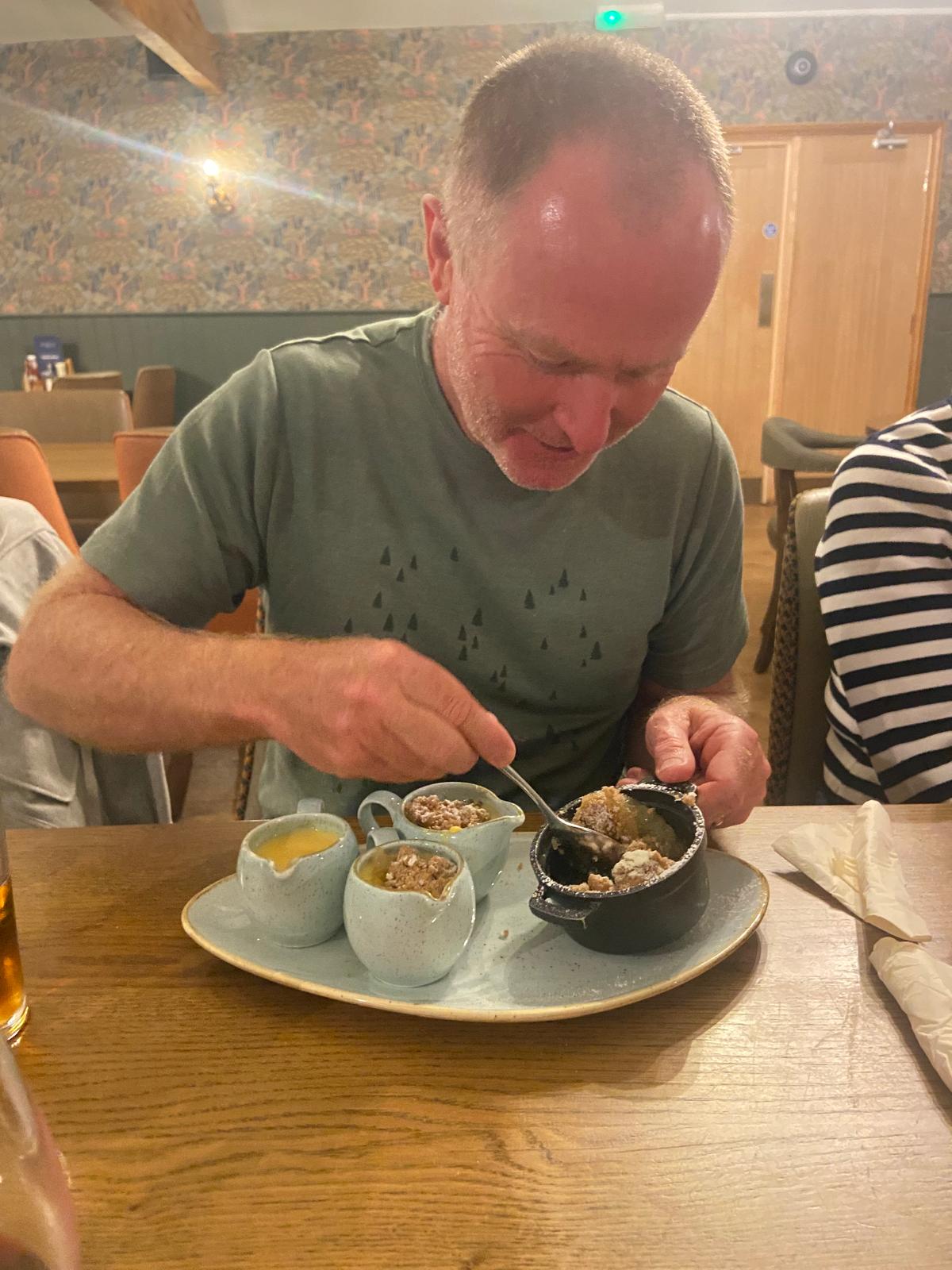 A person eating food on a plate

AI-generated content may be incorrect.